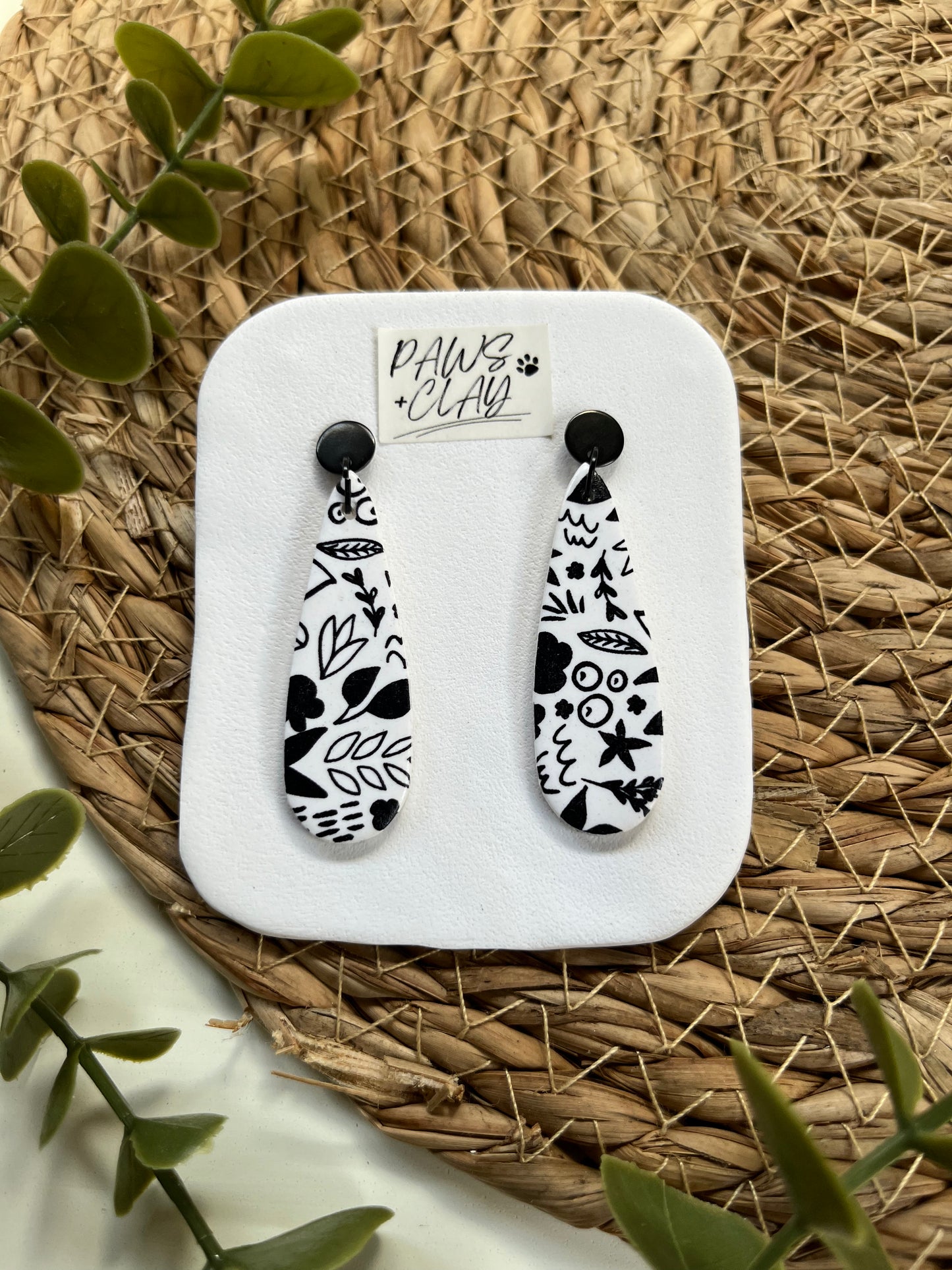 Black and white patterned tear drop shaped polymer clay earrings